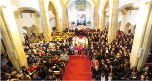 Over 400 pupils squeezed into St Joseph’s Church to celebrate this occasion along their Head Teachers, Deputy Heads and members of staff plus Sacred Heart Choir including Year 11, noticeable by their red jumpers. Uniforms: St Josephs - yellow and brown, St Teresa’s- blue and white, Sacred Heart - blue blazers and Salvatorian in mufti.